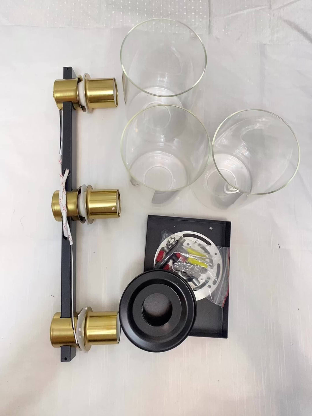 Three Black And Golden Light Fixtures for a Bathroom Vanity Above The Mirror, a Four-Light Modern Brass Wall Sconce Featuring a Glass Ball Shade, And Mid-Century Farmhouse Vanity Lighting (Bulb Not Included).